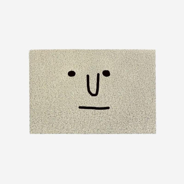 Originální šedá rohožka s obličejem