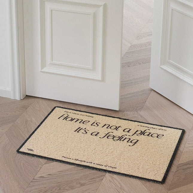 Vstupní rohožka s anglickým nápisem